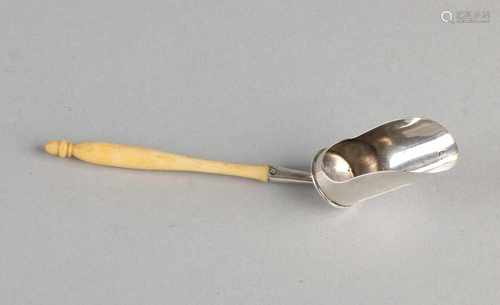 835/000 antique silver tea scoop with special stalk and an ivory handle. Dutch inspected. Circa