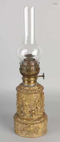 Antique Copper beaten petroleum lamp with Baroque-presentation, figures and grape vines. Circa 1880.