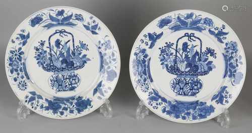 Two large 18th century Chinese porcelain Kangxi plates with flower vase decor. One chip. Size: ø