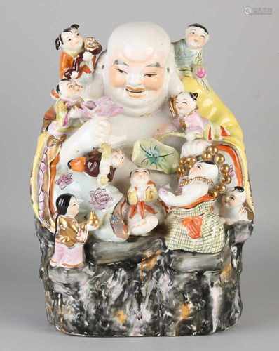 Large Chinese porcelain laughing Buddha. 20th century. Damage to lotus. Size: 34 x 23 x 16 cm. In