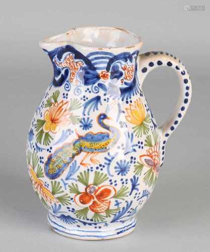 Antique Delft polychrome Fayence jug with floral / peacock decor. Branded Duijn. Size: H 14.5 cm. In