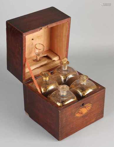 19th Century mahogany casket liqueur with intarsia. With four vials which are equipped with gold