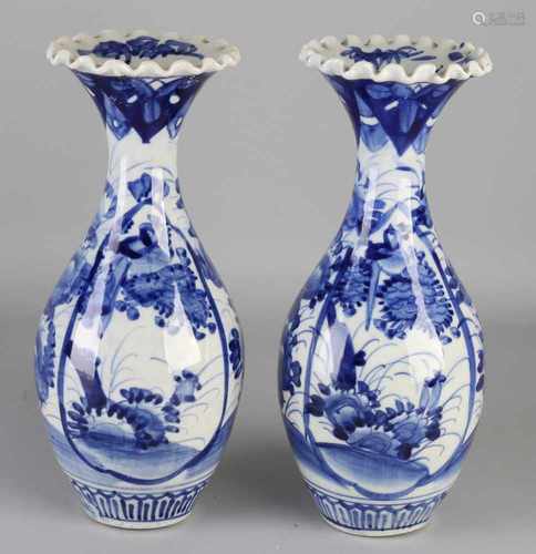 Two 19th century Japanese Imari porcelain collar blue vases with floral decoration. Size: H 29 cm.