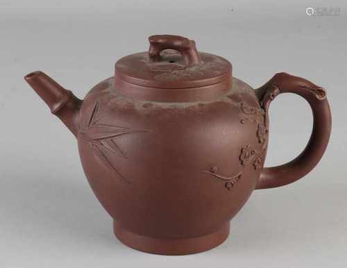 Chinese Yixing teapot with soil brand and blossom / bamboo decor. Size: 12 x 18 x 11 cm dia. In good