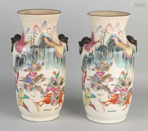 Two 19th century Chinese porcelain vases with polychrome Cantonese fighting figures decor. Bottom