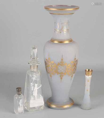 Four parts antique glass, diverse. With gold and enamel decorations. Consisting of: Perfume bottle