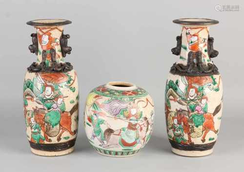 Three pieces of Chinese porcelain. Consisting of: Two vases with Cantonese bottom mark, one chip