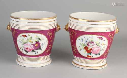 Two 19th century French branded hand-painted porcelain flower pots with saucers underneath.