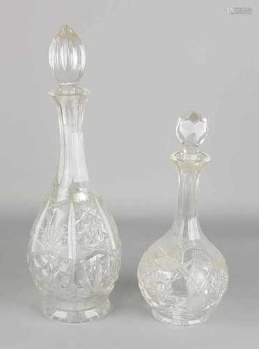 Two faceted crystal decanters. 20th century. Size: H 28-39 cm. In good condition.