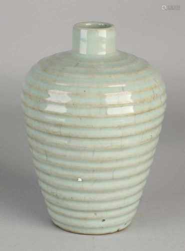 Chinese porcelain vase with ripples and celadon glaze. Dimensions: H 18 x Ø 13 cm. In good