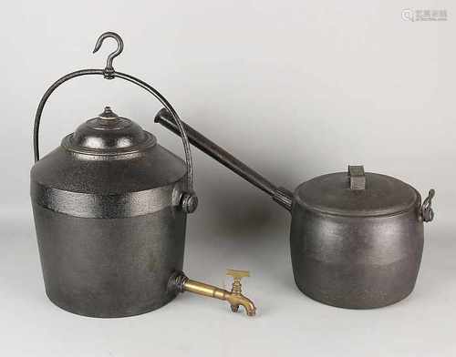 Two 19th century iron pots for witch pull and open fire. Size: 40-60 cm. In good condition.