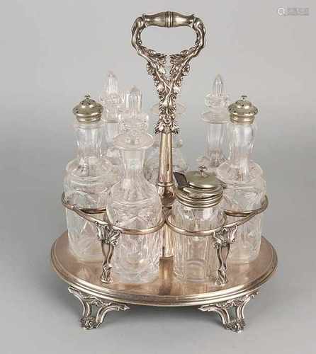 Antique plated eight-piece condiment set with crystal vials. Circa 1900. Size: 30 x 24 x 17 cm. In