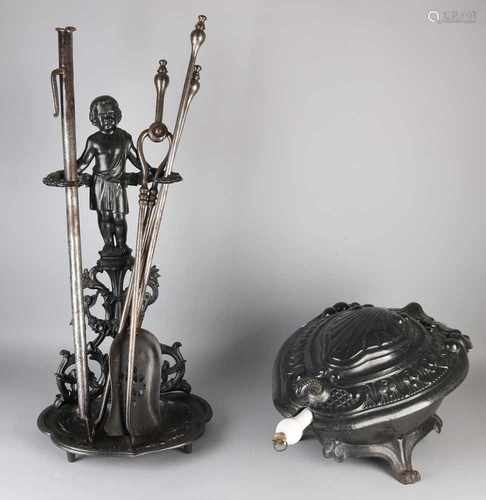 Antique cast iron fireplace set with coal-scuttle. Circa 1880. Five pieces. Size: 45-80 cm. In