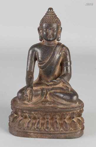 Chinese iron Buddha in lotus position. Size: 21 x 13 x 9 cm. In good condition.