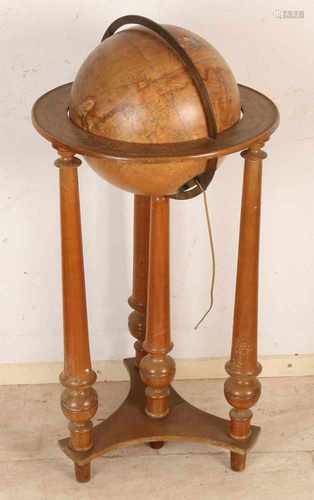 Antique globe with French walnut holder. Glass globe veneered with world map. Paper damaged.