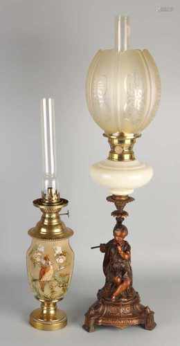 Two standing antique kerosene lamps. Circa 1900. One time Majolica with brass and blue tits decor.