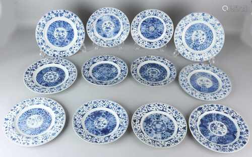 Twelve times 17th - 18th century Chinese porcelain plates with floral decor and bottom mark. Two