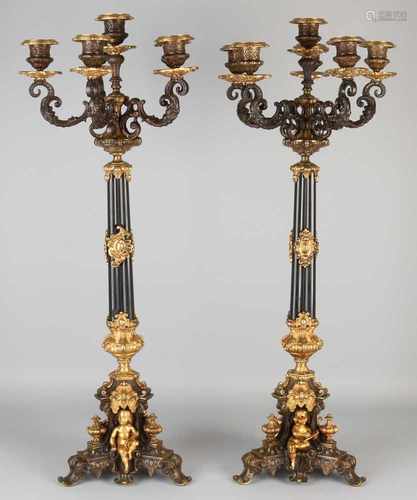 Two large French bronze candlesticks Charles Dix candle surrounded by gilded putti. Two colored,