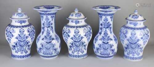 Five-piece antique ceramics Petrus Regout garniture with floral decor. One hairline. Size: 26-34 cm.