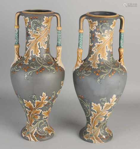 Two German capital Nouveau Mettlach V.B. hand painted stoneware vases. Nr. 2414. Circa 1900.