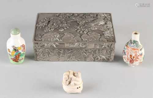 Four times antique, Japan. Consisting of: Two porcelain snuff bottles. One of ivory netsuke,