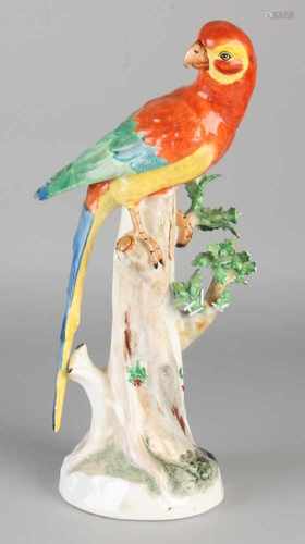 Large German Dresden porcelain parrot. 20th century. Potato chips. Size: H 30 cm. In reasonable