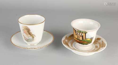 Two large antique German / French porcelain chocolate cups and saucers. One time Empire handpainted,