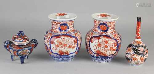 Four parts 19th century Imari porcelain. Comprising: Incense Burner (Koro), good. Set vases,