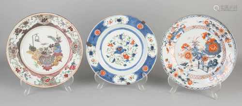 Three 18th - 19th century Chinese porcelain plates. Comprising: Imari, garden / gold decor, good.