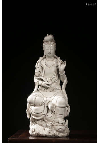 A Chinese Porcelain Ruyi Guanyin Statue