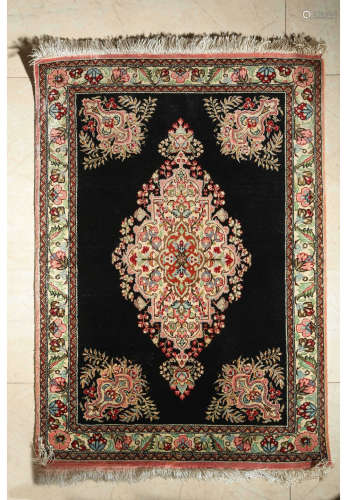 A Chinese Persian Black Ground Floral Silk Carpet