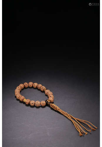 A Chinese Carved Olivary Nucleus Hand String with Box