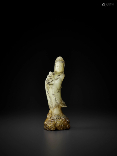 A SOAPSTONE FIGURE OF GUANYIN AND CHILD, Q…