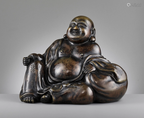 A LARGE AND HEAVILY CAST BRONZE OF BUDAI, QI…