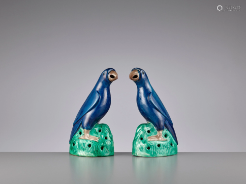 A PAIR OF SAPPHIRE BLUE GLAZED PARROTS, KAN…