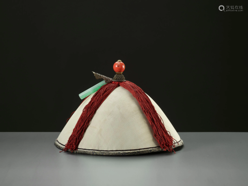 AN OFFICIAL'S SUMMER HAT WITH A CORAL FINIAL, …