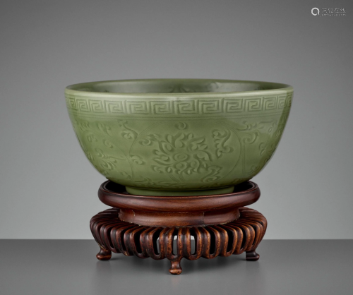 A CARVED LONGQUAN 'LOTUS' BOWL, MING DYNA…