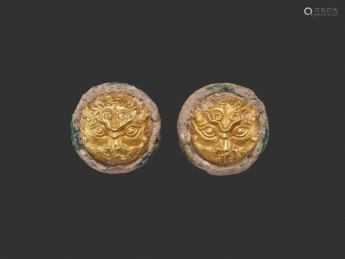A PAIR OF GOLD REPOUSSE ORNAMENTS, WA…