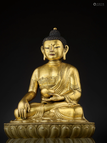 A LARGE MING DYNASTY STATUE OF BUDDH…