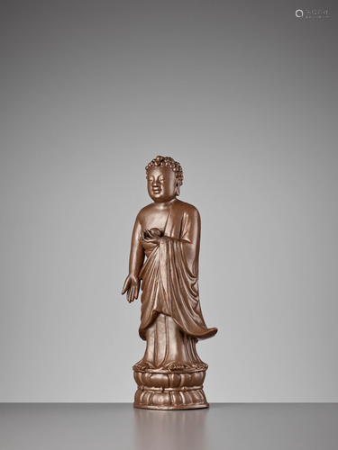 A PERSIMMON-GLAZED STATUE OF BHAISAJYAGURU, …