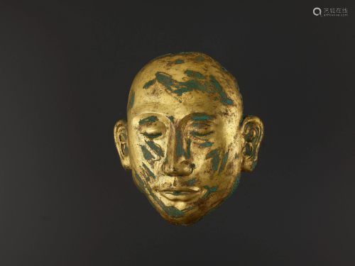 A RARE GILT-COPPER DEATH MASK, LIAO DYNASTY