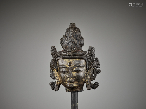 A TIBETAN LACQUER-GILT BRONZE HEAD 14TH CE…