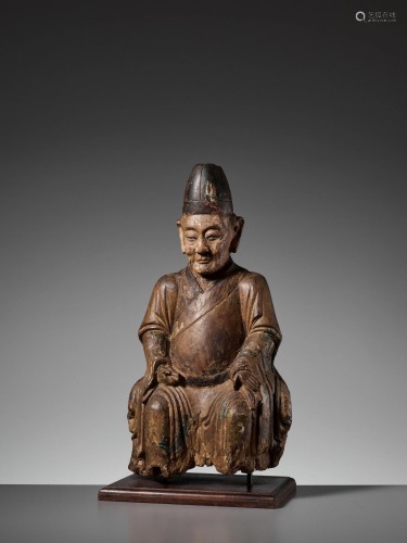 A JIN - MING DYNASTY WOOD FIGURE OF AN IMMO…