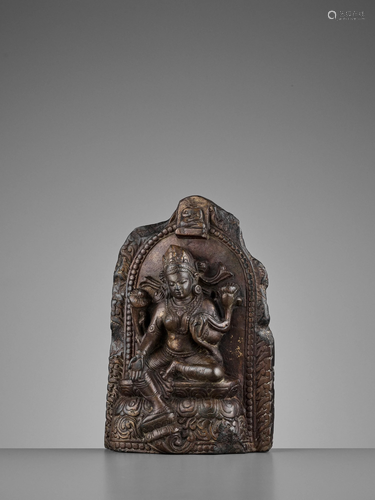 A LIMESTONE STELE OF TARA, NEPAL, 15/16TH CENT…