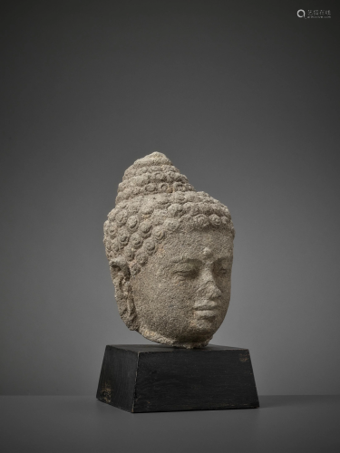 AN ANDESITE HEAD OF BUDDHA, JAVA 9TH-10TH CE…