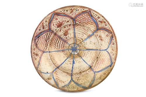 AN HISPANO-MORESQUE COPPER-LUSTRE POTTERY CHARGER