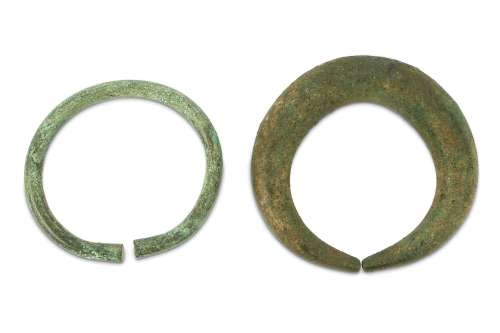 AN ANCIENT BRONZE ANKLET AND A PENANNULAR BRACELET PROPERTY OF THE LATE BRUNO CARUSO (1927 - 2018)