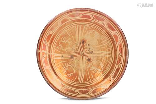 AN HISPANO-MORESQUE COPPER-LUSTRE POTTERY DISH