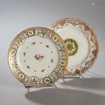 BORDEAUXTwo porcelain plates with contoured edges and polychrome decoration, one with a rosette on a green background in the centre and mauve festoon on the wing, the other with a rose in the centre and on the wing with foliage, roses and garlands of pearls.Marked: W in gold.Manufacture of Verneuilh and Vanier.18th century. Diameter : 24.5 cm.(One with a restored luster, the other with luster, cracks and wears)