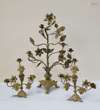 Pair of gilded metal altar candelabra with flower and vine decoration.